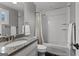 Bathroom with a shower and bath, granite topped vanity, and tile flooring at 55 Jolie Ln, Sharpsburg, GA 30277