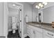 Stylish bathroom featuring a granite countertop and a decorative light fixture at 55 Jolie Ln, Sharpsburg, GA 30277