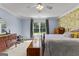 Charming bedroom with hardwood furniture, large window overlooking the greenery outside, and warm, inviting atmosphere at 55 Jolie Ln, Sharpsburg, GA 30277