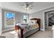 Bedroom featuring sunny windows and an adjacent bathroom, perfect for a relaxing retreat at 55 Jolie Ln, Sharpsburg, GA 30277