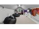 Spacious bonus room with beanbag chairs, mounted TV, and ample space for recreation and entertainment at 55 Jolie Ln, Sharpsburg, GA 30277