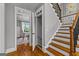 Beautiful staircase with wood steps, iron spindles, and access to an elevator at 55 Jolie Ln, Sharpsburg, GA 30277