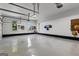 Spacious garage with epoxy flooring, ample storage, and natural light from windows providing great visibility at 55 Jolie Ln, Sharpsburg, GA 30277