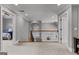 Upstairs landing area featuring wrought iron railing, carpet flooring, and access to multiple rooms at 55 Jolie Ln, Sharpsburg, GA 30277