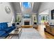Bright and airy living room with fireplace and large windows at 55 Jolie Ln, Sharpsburg, GA 30277