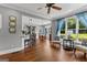 Open living space with hardwood floors, access to dining and kitchen areas, with natural light at 55 Jolie Ln, Sharpsburg, GA 30277