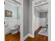 Powder room with wainscoting and hardwood floors at 55 Jolie Ln, Sharpsburg, GA 30277