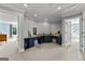 Elegant vanity area boasts custom blue cabinetry, granite countertops, and a spacious layout perfect for dressing at 55 Jolie Ln, Sharpsburg, GA 30277
