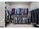 Large walk-in closet equipped with built-in shelving and hanging racks, suitable for extensive wardrobe at 55 Jolie Ln, Sharpsburg, GA 30277
