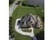Breathtaking aerial view of a home with a long drive, manicured lawn and landscaping at 413 Canterbury Way, Jonesboro, GA 30236