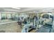 Home gym with mirrored walls, a variety of exercise equipment, and natural light at 413 Canterbury Way, Jonesboro, GA 30236