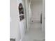 Bright hallway with marble floors and built in shelving unit at 413 Canterbury Way, Jonesboro, GA 30236