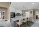 Kitchen island featuring a breakfast bar, stainless steel appliances, and pendant lighting at 413 Canterbury Way, Jonesboro, GA 30236