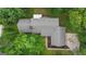 Aerial view of home featuring a well-maintained roof surrounded by lush green trees at 190 Willow Lake Ln, Sharpsburg, GA 30277