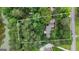 Secluded home surrounded by lush greenery and a serene lake, offering privacy and natural beauty at 190 Willow Lake Ln, Sharpsburg, GA 30277
