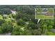 An aerial view of a beautiful home, nestled among mature trees and close to a picturesque lake at 190 Willow Lake Ln, Sharpsburg, GA 30277