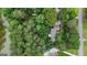 Secluded home surrounded by lush greenery and a serene lake, offering privacy and natural beauty at 190 Willow Lake Ln, Sharpsburg, GA 30277