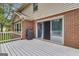 Open deck area featuring grill, slider access to home, and wooded area at 190 Willow Lake Ln, Sharpsburg, GA 30277