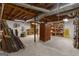 Unfinished basement space with concrete floor and exposed ceiling, offering ample potential for storage or customization at 190 Willow Lake Ln, Sharpsburg, GA 30277