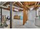 Unfinished basement space with concrete floor and exposed ceiling, offering ample potential at 190 Willow Lake Ln, Sharpsburg, GA 30277