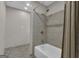 Bathroom featuring a tub/shower combination and tiled walls at 190 Willow Lake Ln, Sharpsburg, GA 30277