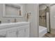 Well-lit bathroom includes tub/shower combo and vanity at 190 Willow Lake Ln, Sharpsburg, GA 30277