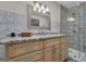 Stylized bathroom with modern vanity with granite countertops and tiled walk-in shower at 190 Willow Lake Ln, Sharpsburg, GA 30277