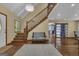 Spacious foyer with wood floors, staircase, elegant chandelier and lots of natural light at 190 Willow Lake Ln, Sharpsburg, GA 30277
