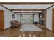 Cozy living room boasts a brick fireplace, hardwood flooring, and ample natural light at 190 Willow Lake Ln, Sharpsburg, GA 30277
