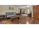 Open-concept living area featuring hardwood floors, natural light, and comfortable seating, ideal for relaxation at 190 Willow Lake Ln, Sharpsburg, GA 30277