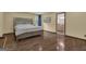 Spacious main bedroom with hardwood floors and an ensuite bathroom at 190 Willow Lake Ln, Sharpsburg, GA 30277