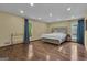 Bright main bedroom with hardwood floors and serene outdoor view at 190 Willow Lake Ln, Sharpsburg, GA 30277