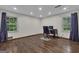 Bright office space with wood floors and natural light from two large windows at 190 Willow Lake Ln, Sharpsburg, GA 30277