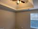 A bright bedroom featuring a ceiling fan and a window that brings in plenty of natural light at 149 Titan Rd, Stockbridge, GA 30281
