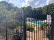 Community pool area surrounded by a secure fence and featuring a 