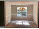 Well-lit dining room featuring chair rail molding, chandelier and a large window at 149 Titan Rd, Stockbridge, GA 30281