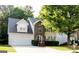 Charming two-story home with brick facade, attached garage, and well-maintained landscaping at 149 Titan Rd, Stockbridge, GA 30281