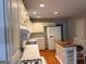 Well-appointed kitchen featuring white cabinets, stainless steel appliances and a center island at 149 Titan Rd, Stockbridge, GA 30281