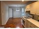 Functional kitchen with white cabinets, gas range, hardwood floors, eat-in breakfast area at 149 Titan Rd, Stockbridge, GA 30281