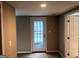 Room featuring neutral walls and flooring and a bright glass-paneled door at 149 Titan Rd, Stockbridge, GA 30281