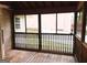 Relaxing screened-in porch with wood flooring and view of the backyard at 149 Titan Rd, Stockbridge, GA 30281