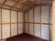 Interior view of a shed featuring exposed framing and white-paneled walls at 149 Titan Rd, Stockbridge, GA 30281