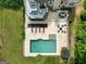 Aerial view of an in-ground pool with outdoor furniture and patio at 2975 Hickory Hill Rd, Brooks, GA 30205
