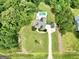 Expansive aerial view of home site, featuring pool, surrounding landscape and long driveway at 2975 Hickory Hill Rd, Brooks, GA 30205