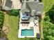 Aerial view showcasing the beautiful backyard with a pool, deck, and well-manicured lawn at 2975 Hickory Hill Rd, Brooks, GA 30205