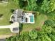 Overhead view of the home with an in-ground pool, patio, and surrounding yard at 2975 Hickory Hill Rd, Brooks, GA 30205