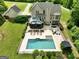 Aerial view of a home and surrounding land with lush greenery at 2975 Hickory Hill Rd, Brooks, GA 30205