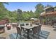 Spacious backyard features a pool, patio with dining set, and lush greenery at 2975 Hickory Hill Rd, Brooks, GA 30205