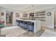 Finished basement with bar, seating, shelving, and concrete flooring at 2975 Hickory Hill Rd, Brooks, GA 30205