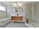 Modern bathroom featuring double vanity sinks, soaking tub and a glass shower at 2975 Hickory Hill Rd, Brooks, GA 30205